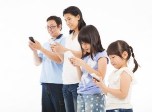 Family using mobile phones
